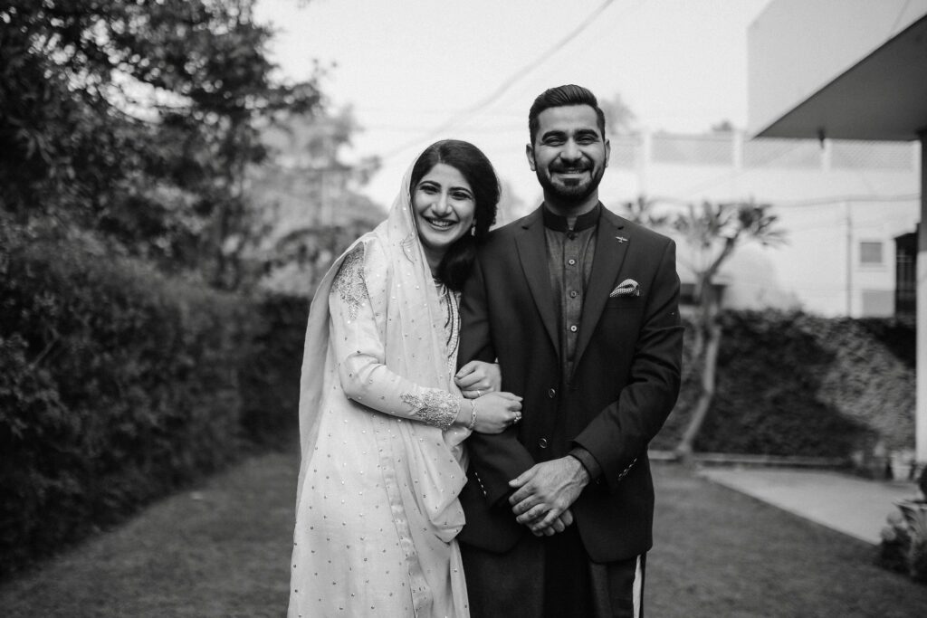 a wedding photographer captured a posed photo of newlyweds radiating with joy