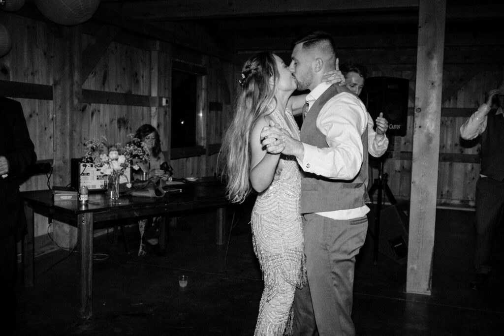 newlyweds kiss while dancing