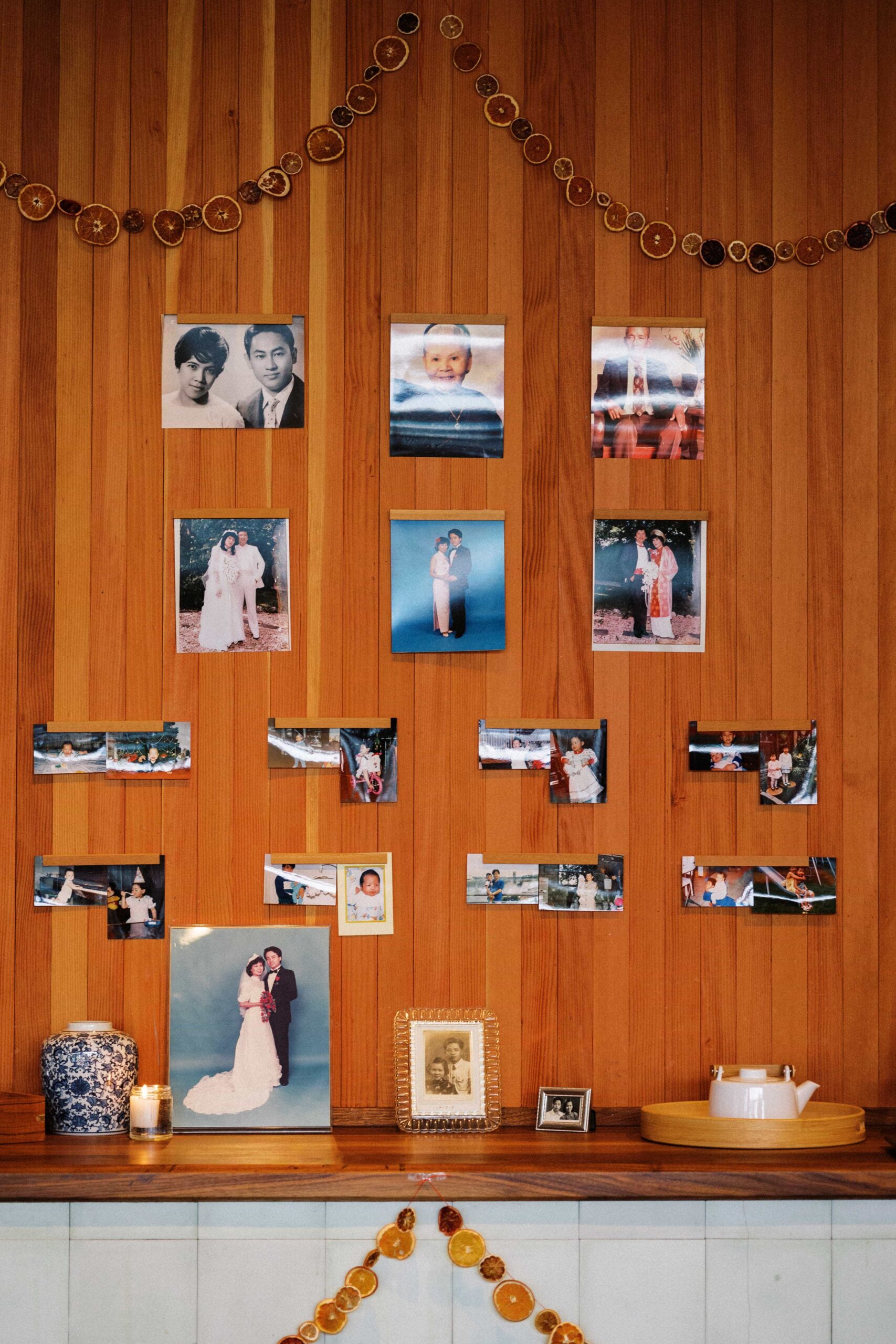 family member photos are displayed at a wedding recpetion